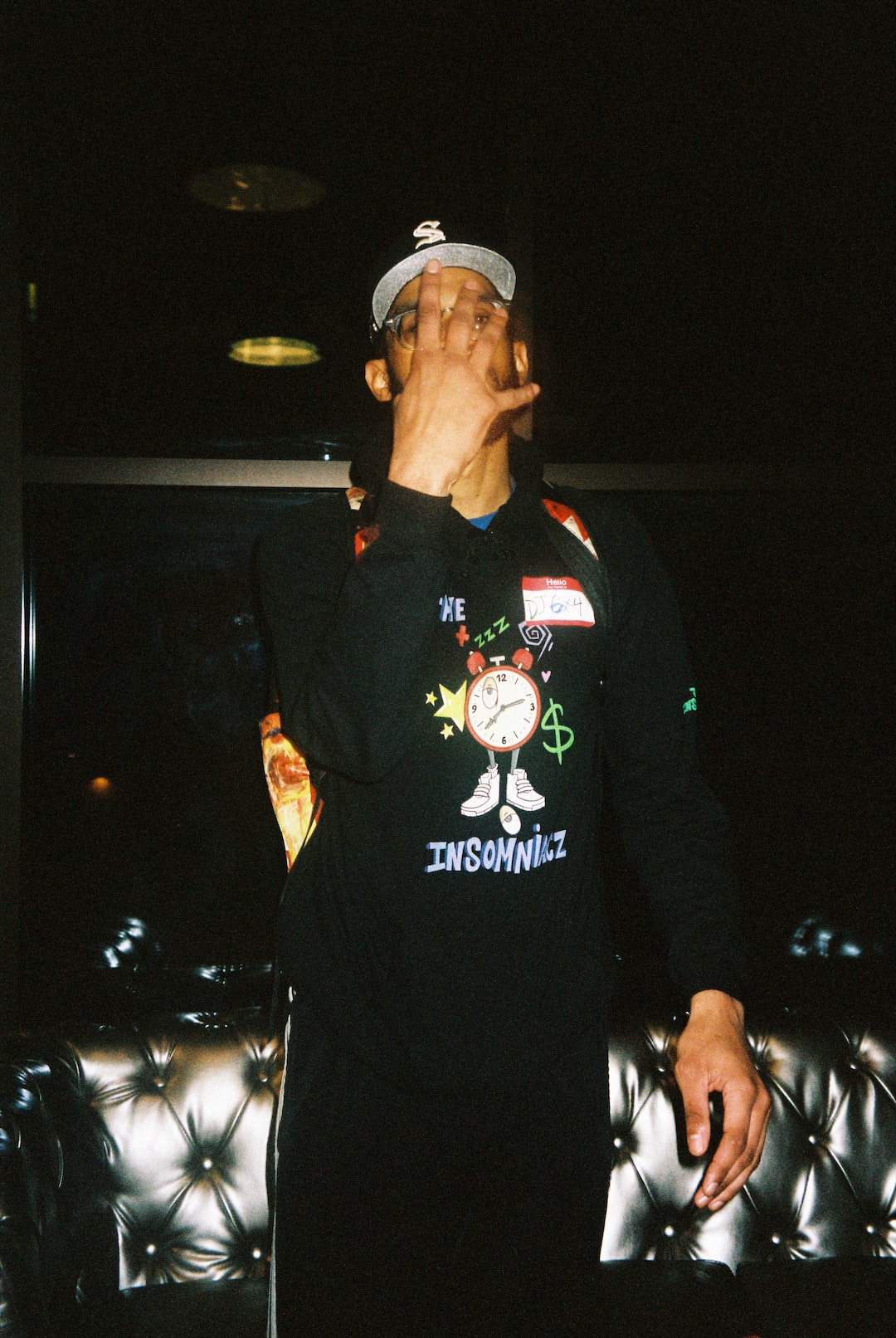 man in black and green zip up jacket