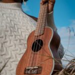 A Woman Holding a Ukulele