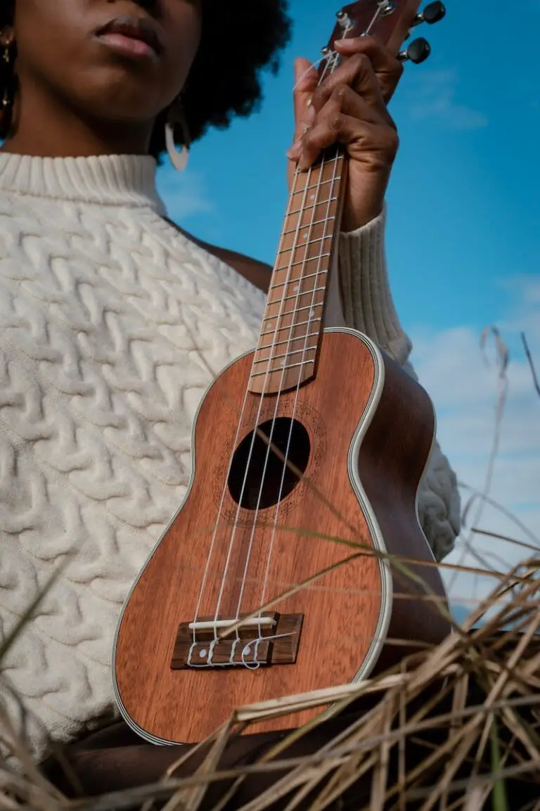 A Woman Holding a Ukulele