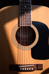 acoustic guitar hole with dramatic lighting