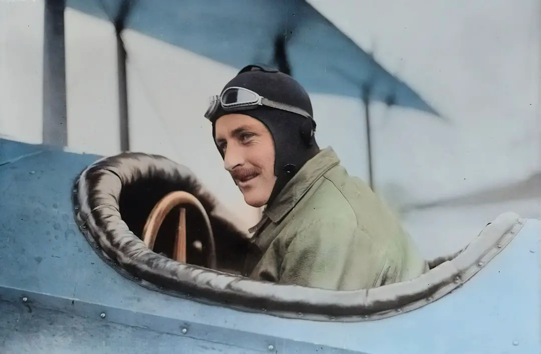 Originally from the Library of Congress, this AI recoloured photograph depicts early aviator Steve MacGordon circa 1915 in the cockpit of a biplane shortly before his death. MacGordon was one of the earliest pioneers in aviation and held many of the inaugural records in flight. by Guitar Brands man inside biplane