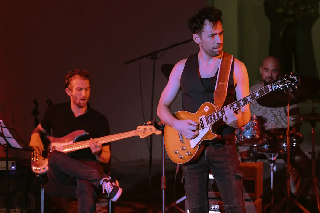 ✅ Conclusion: Our Final Verdict on Jackson Guitars – Are They Worth the Hype? by Guitar Brands A group of men playing guitars on stage